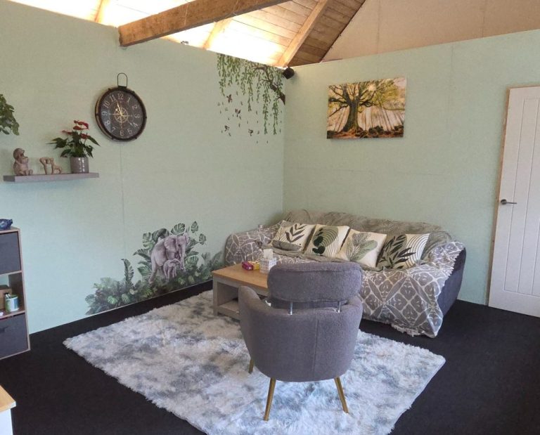 face 2 face session coming soon image shows 2 people on a sofa with a cuppa tea for in person therapy